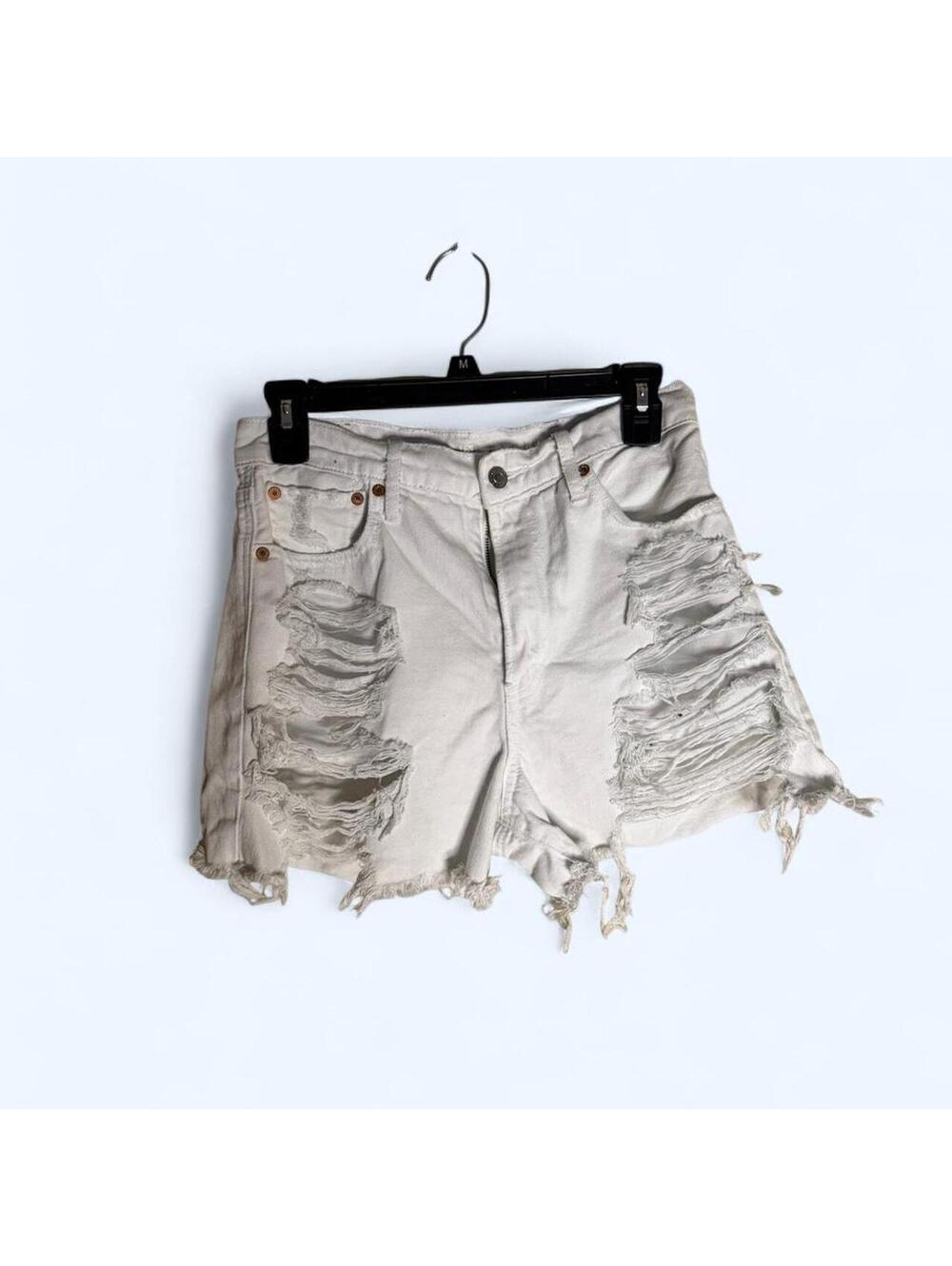 White denim shorts with frayed hem